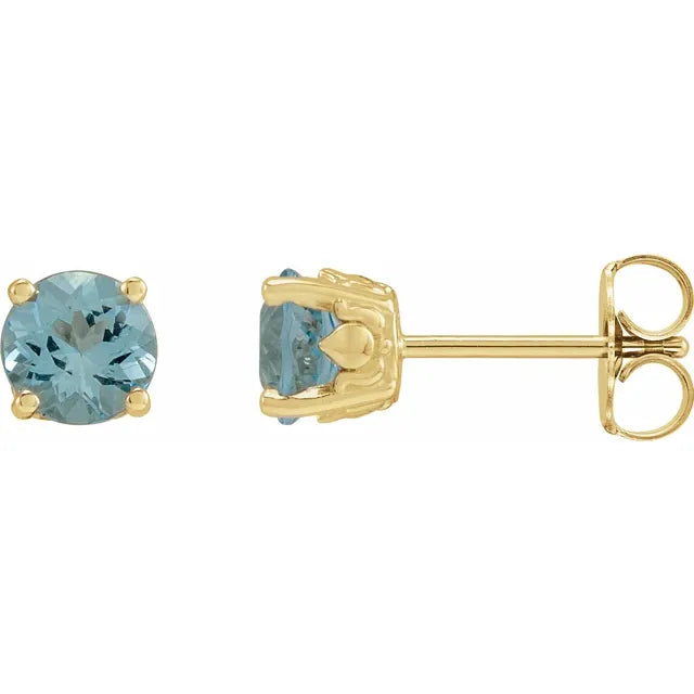 A pair of 14K gold round cut stud earrings with natural aquamarine stones, displayed against a white background.