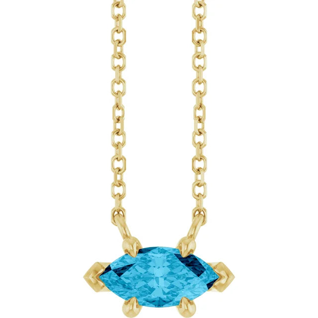 A marquise-cut aquamarine necklace set in 14K solid gold, with a classic fine gold chain.
